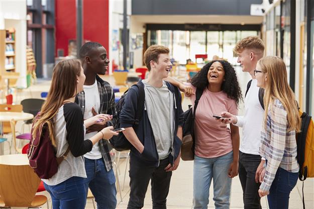 diverse group of students laughing together